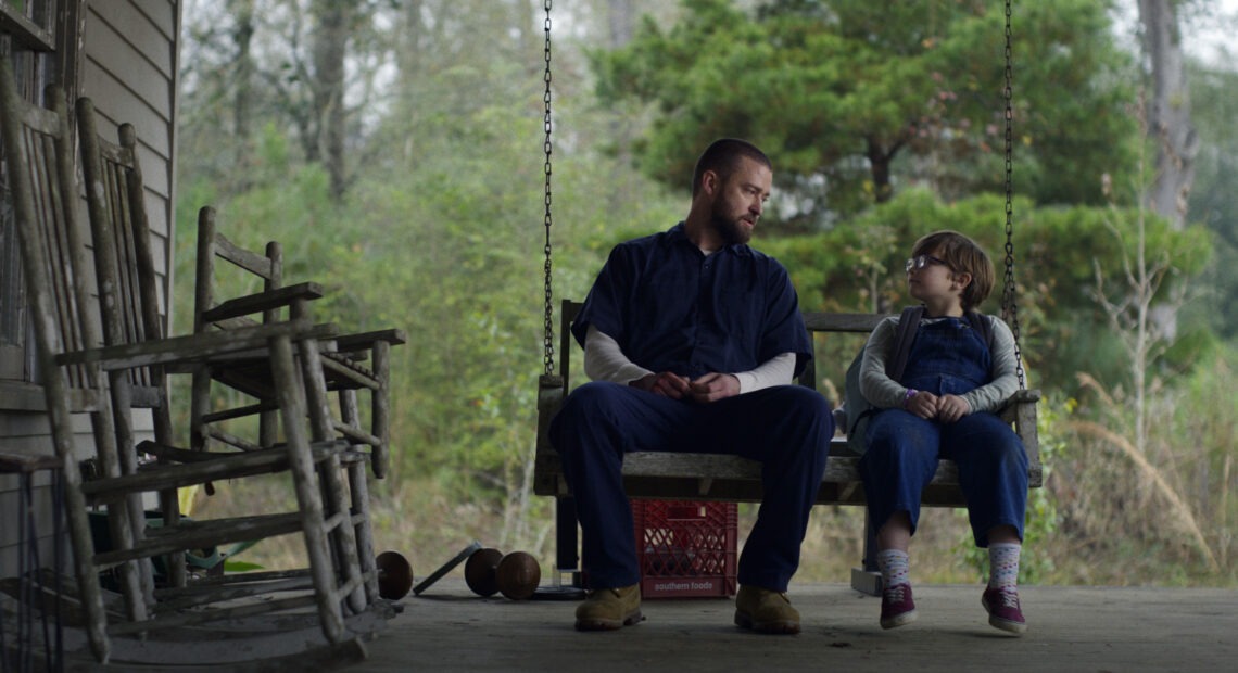 Justin Timberlake (left) and Ryder Allen star as Eddie and Sam in the new movie Palmer on Apple TV+. Apple TV+