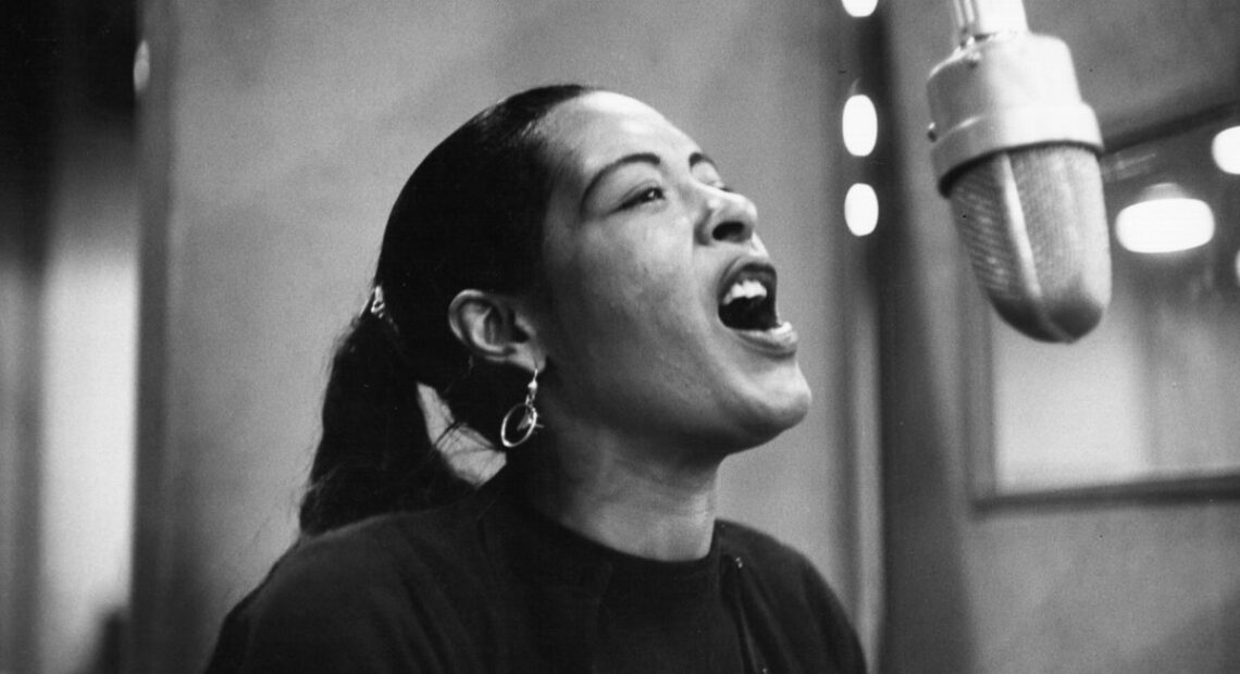 Singer Billie Holiday records her penultimate album "Lady in Satin" at the Columbia Records studio in New York City, in 1957. CREDIT: Michael Ochs Archives/Getty Images