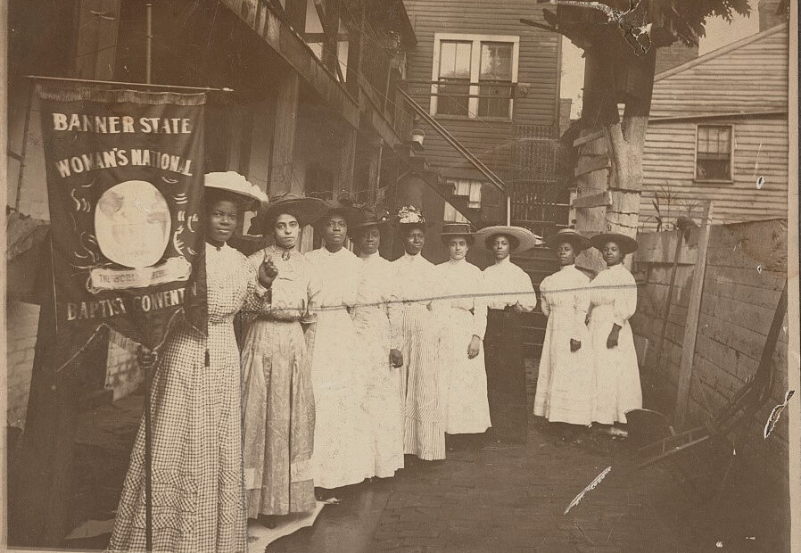 Dated between 1905 and 1915, this photo shows Nannie Helen Burroughs holding a banner that reads, “Banner State Woman’s National Baptist Convention.” Photo courtesy of Library of Congress