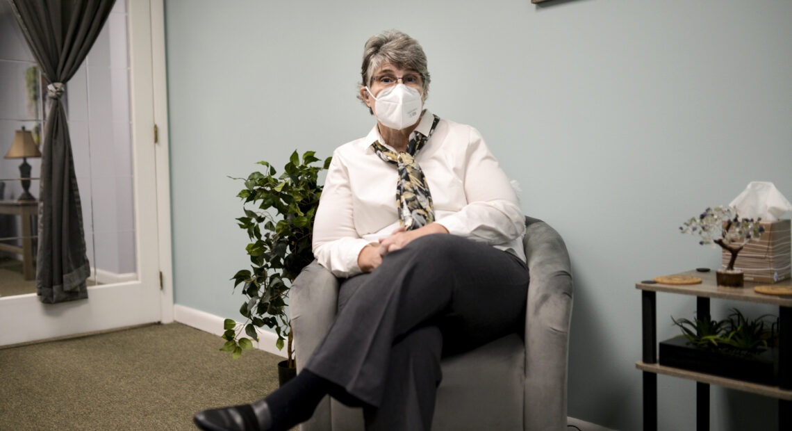 Jodee Pineau-Chaisson sits in her office in Springfield, Mass. on January 12, 2021. Pineau-Chaisson, a social worker, contracted the coronavirus last May and continues to have symptoms even months after testing negative for the virus. Meredith Nierman/GBH News