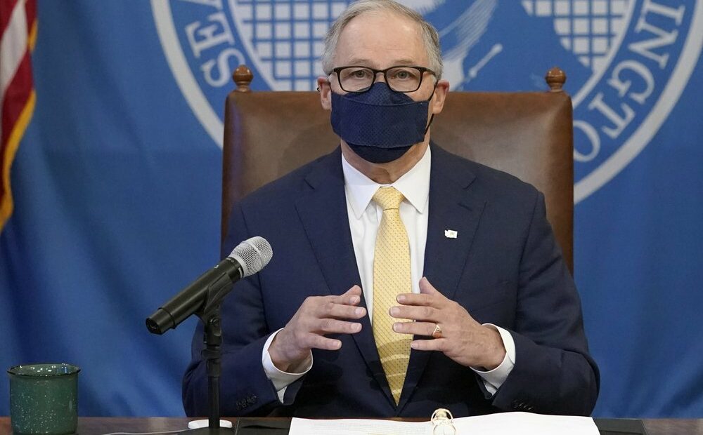 Washington Gov. Jay Inslee speaks during a news conference, March 12, 2021, at the Capitol in Olympia, Wash. Inslee said he will issue an emergency proclamation next week that will require all public schools in the state to offer students an in-person learning option starting in April. CREDIT: Ted S. Warren/AP