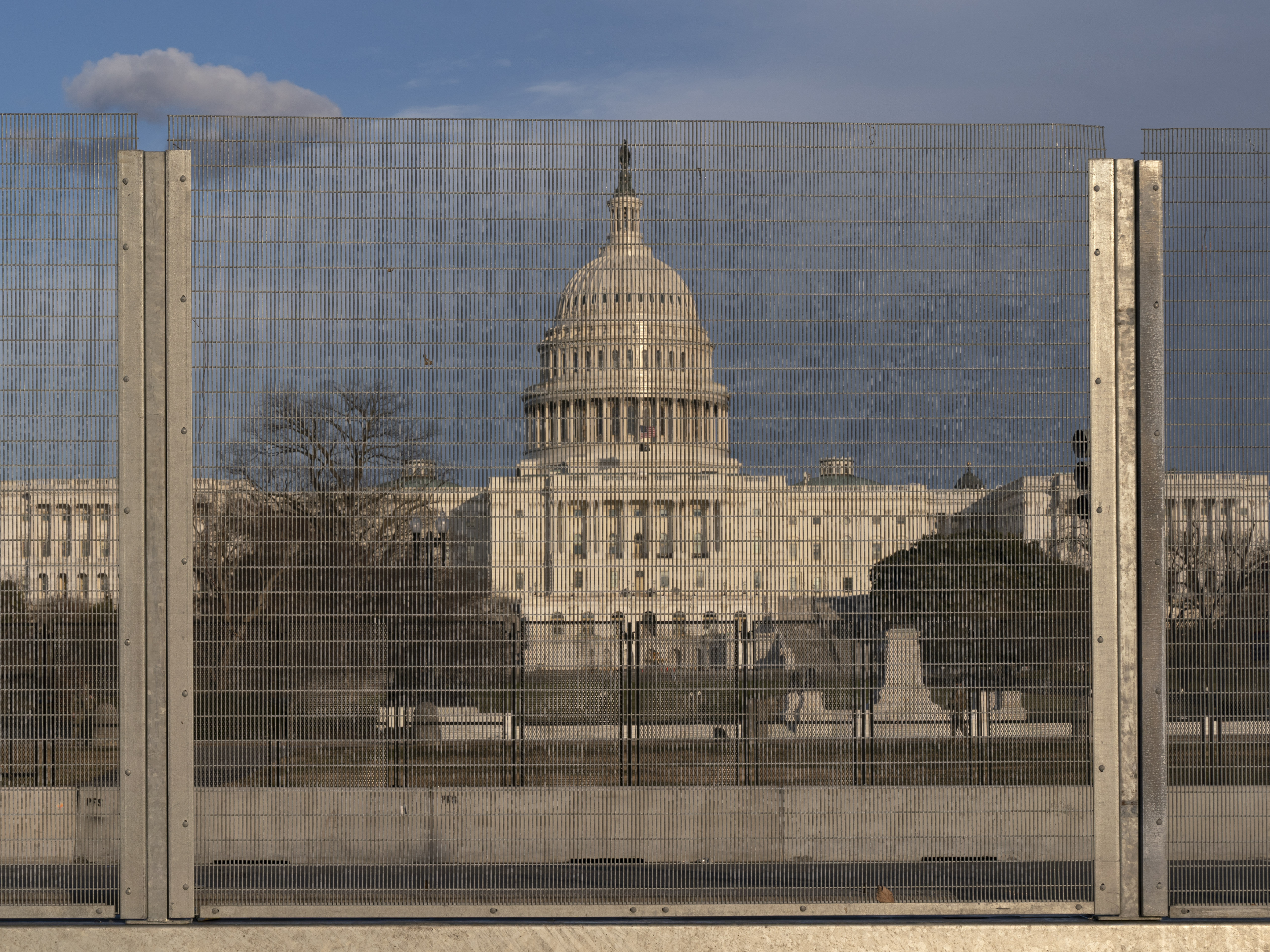 A section of fencing blocks the Capitol grounds at sunset on Monday. CREDIT: Jacquelyn Martin/AP