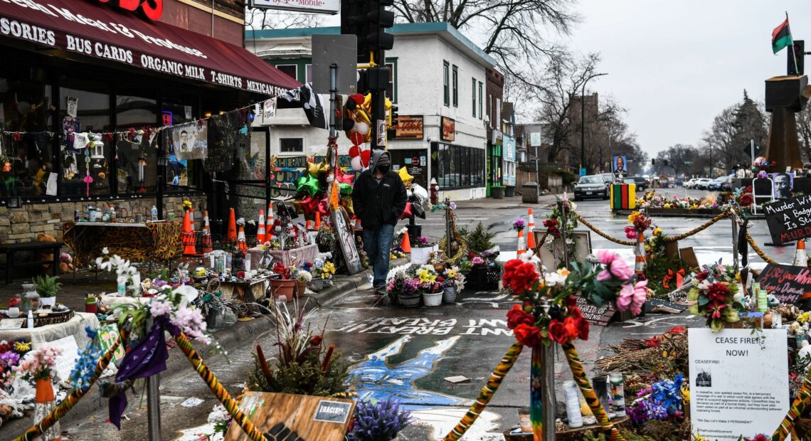 A makeshift memorial in Minneapolis honors George Floyd as jury selection begins in the trial of former police officer Derek Chauvin. CREDIT: Chandan Khanna/AFP via Getty Images