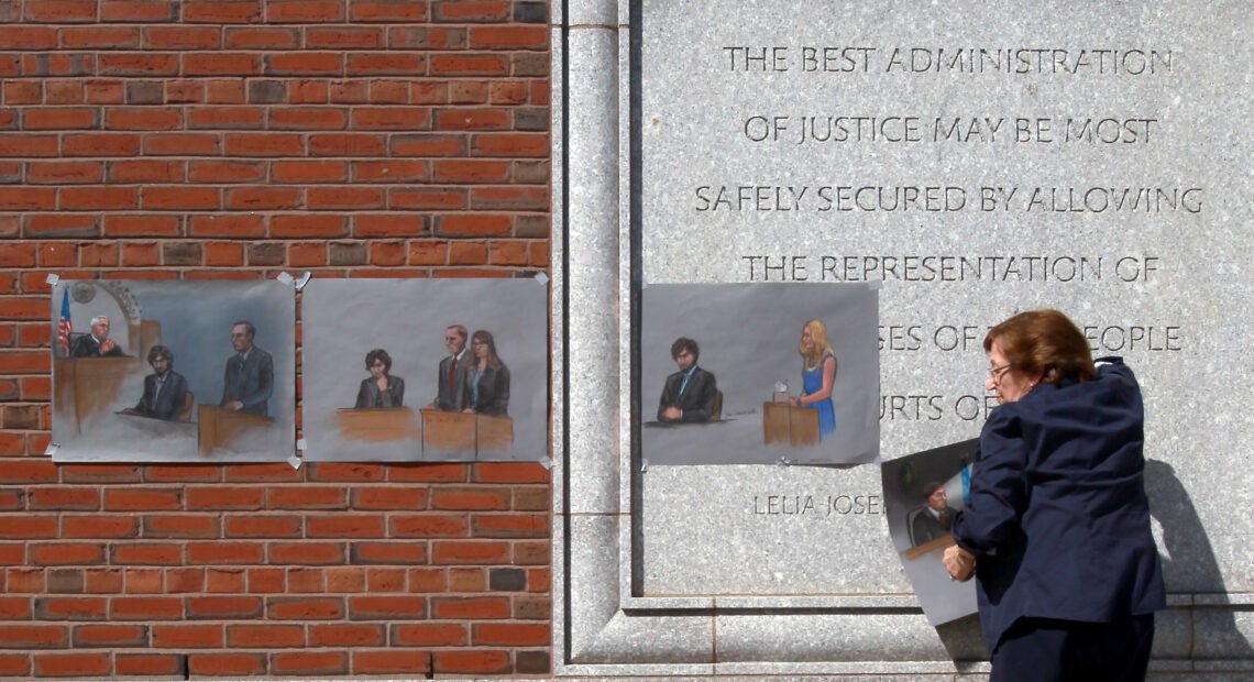 The U.S. Supreme Court will review a lower court's decision from last summer that vacated the six death sentences imposed on Boston Marathon bomber Dzhokhar Tsarnaev. Here, artist Jane Flavell Collins pulls down her courtroom sketches outside the Moakley U.S. Courthouse in Boston after Tsarnaev was sentenced. John Blanding/Boston Globe via Getty Images