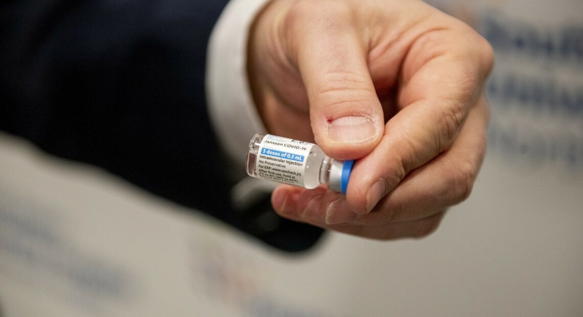 A health care worker holds a vial of the Johnson & Johnson COVID-19 vaccine at South Shore University Hospital in Bay Shore, N.Y., on Wednesday. CREDIT: via Getty Images