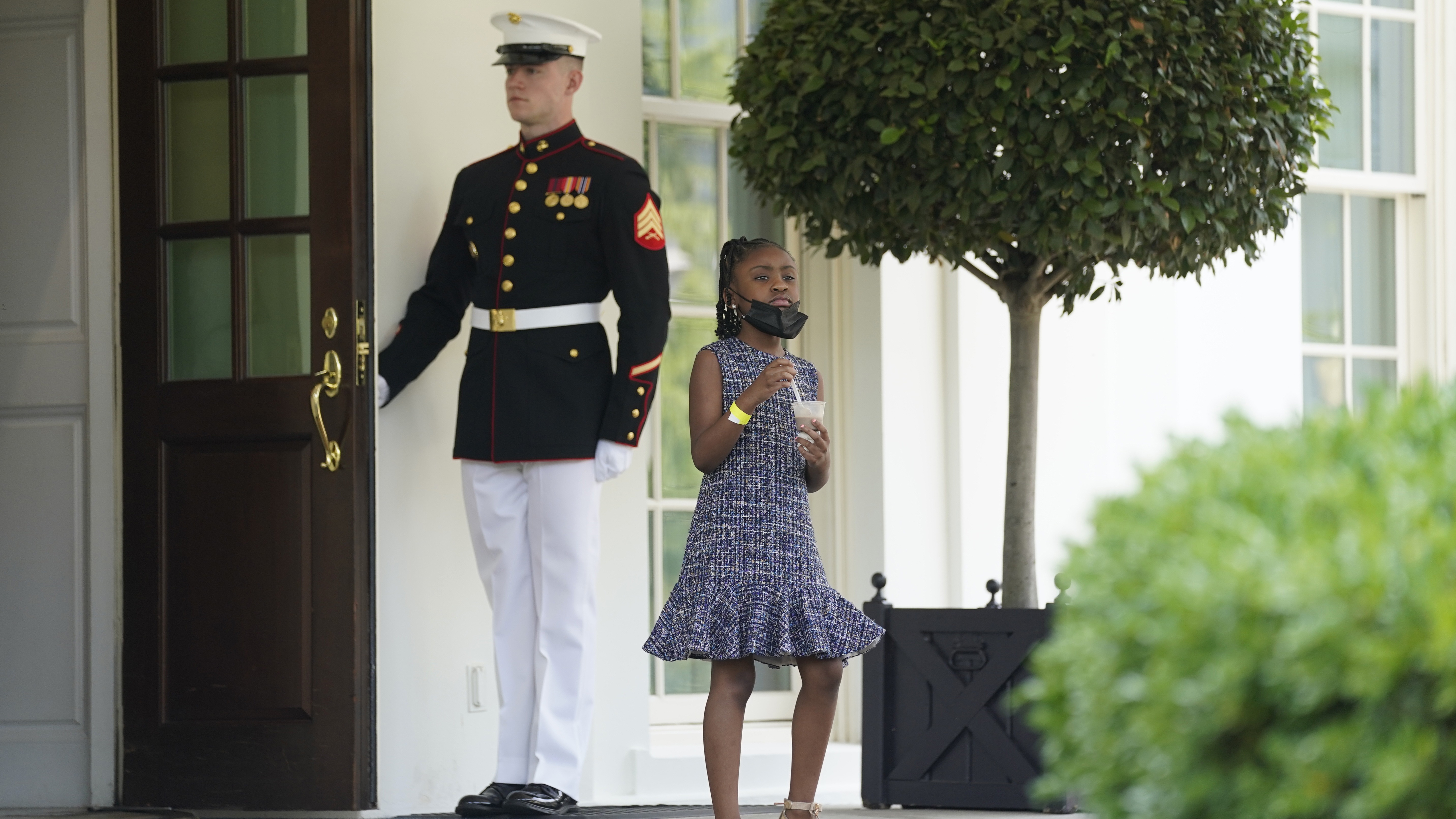 Gianna Floyd, George Floyd's daughter, walks out of the West Wing door at the White House after meeting Tuesday with President Biden and Vice President Harris. CREDIT: Evan Vucci/AP