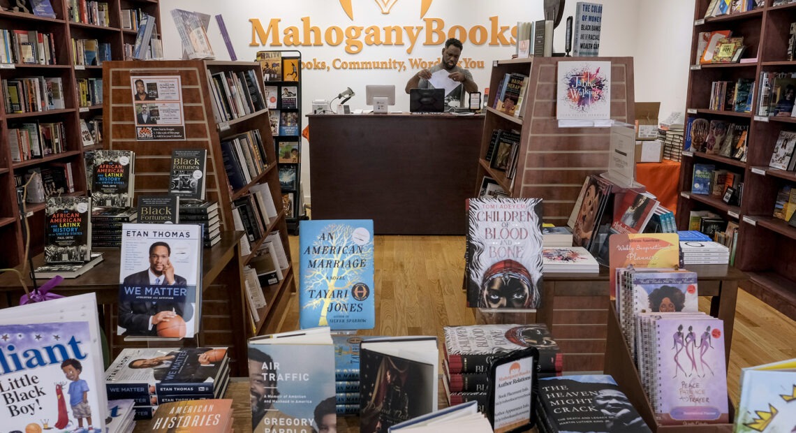 Derrick Young, co-owner of Mahogany Books in Washington, D.C., says his store has seen new customers in the last year who seem to be "willing to do the work" to educate themselves on issues of race in America. Bonnie Jo Mount/Getty Images