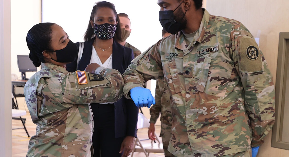 Maryland National Guard Brig. Gen. Janeen Birckhead greets soldiers last week at a mobile vaccine clinic in Wheaton, Md.