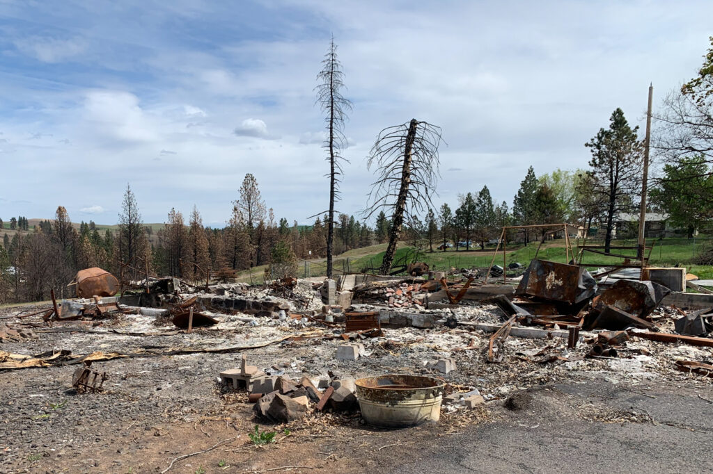 The cleanup of toxic debris has been slowed in Malden Wash. after former President Trump held up aid as part of a political dispute with the state's Democratic governor. Kirk Siegler/NPR