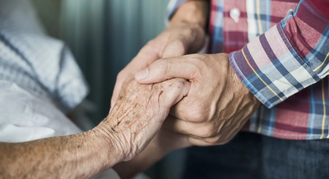 The COVID-19 pandemic has been particularly difficult for unpaid caregivers, with many reporting symptoms of stress, anxiety, and depression. CREDIT: Portra Images via Getty Images