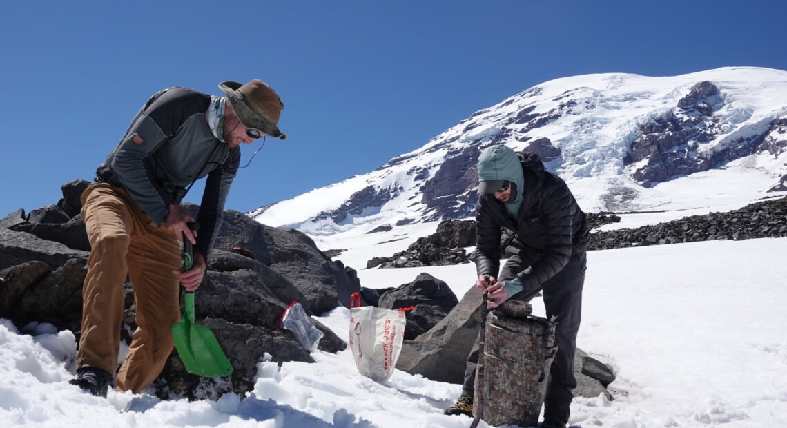 Photo of researchers on the icey mountain.