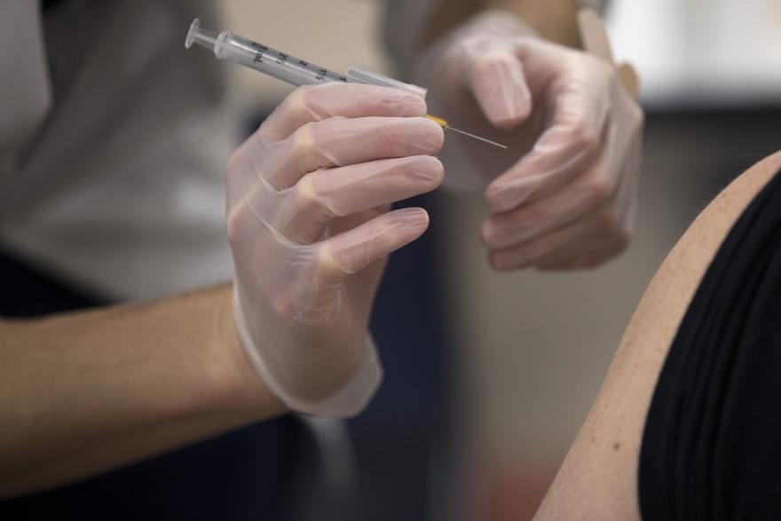 Pharmacist Rui Wen prepares to administer a Johnson & Johnson COVID-19 vaccine for an employee of the Safeway Distribution Center on Monday, March 22, 2021, in Auburn. COVID deaths are trending much higher in Republican counties in Washington where vaccination rates tend to be lower.