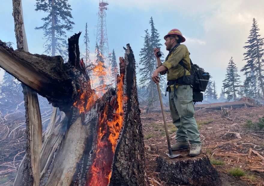 Fire crews on the Schneider Springs fire burned around the critical communication tower on Bethel Ridge to protect it from the main fire