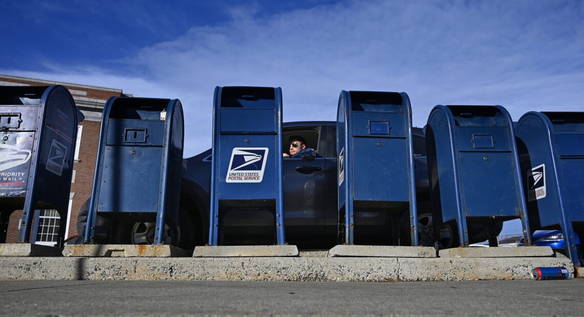 The Postal Service says the predicted slowdown is caused in part by the agency's decision to rely less on moving mail by air and more by ground transportation.