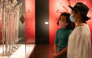 Visitors look at an exhibit at Tacoma's Museum of Glass.