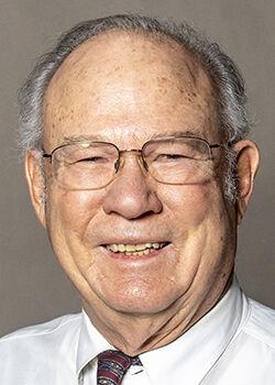 A portrait of Dr. Richard Eggleston smiling at the camera