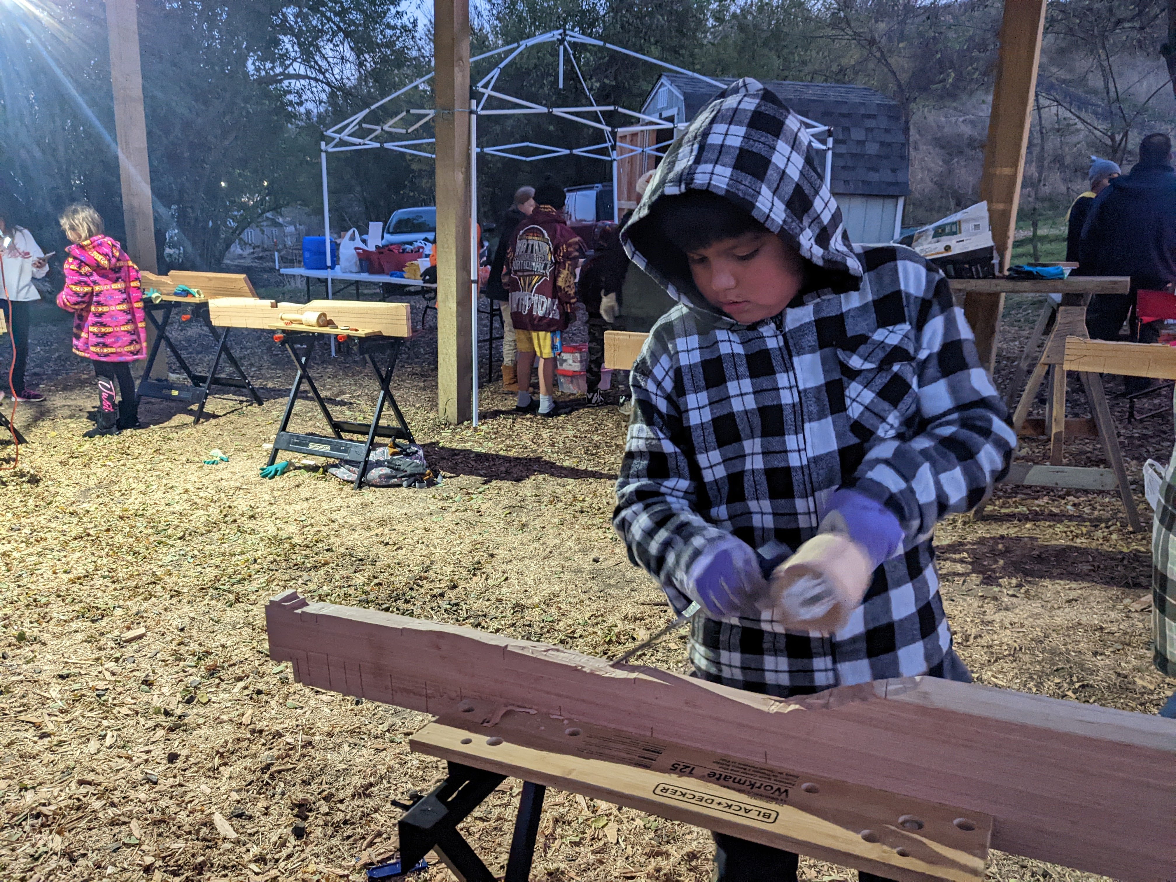 Fourth grader Jalone Green works on his paddle in Lapwai, Idaho.