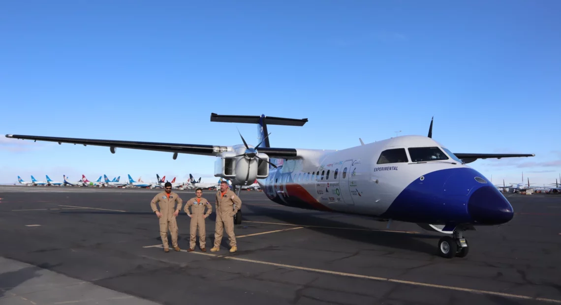 The Universal Hydrogen flight test crew posed for pictures after a successful first flight of the company's hydrogen-electric Dash 8 airliner on March 2, 2023