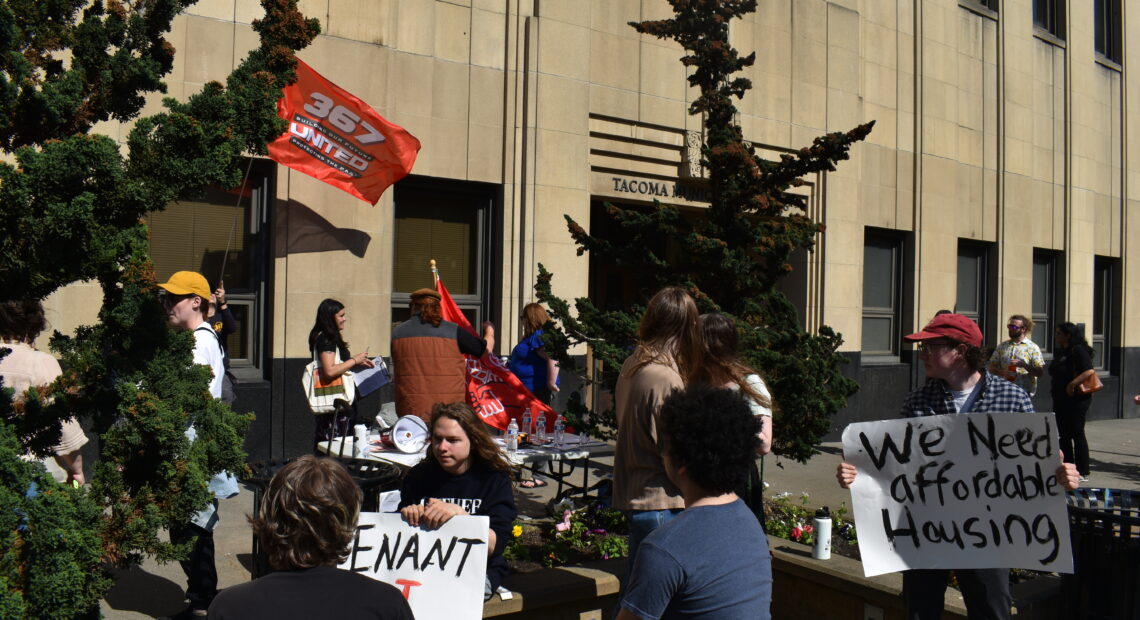 On May 25, a number of supporters of the Tacoma For All initiative for tenant protections, rallied in front of the City Hall building. Photo by Lauren Gallup.