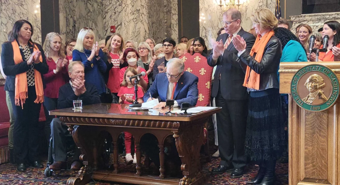 Washington Gov. Jay Inslee signed three new gun bills into law Tuesday, including an assault weapons ban that takes immediate effect