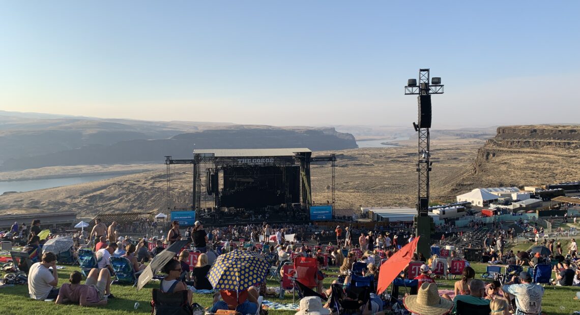 Near sunset at the Gorge Amphitheater, the Columbia River rolls at the back hip of the mainstage, while Dave Matthews plays last summer