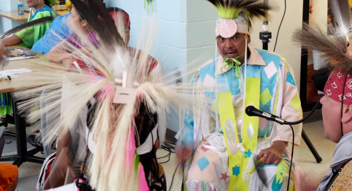 Travis ComesLast, center right, is known as a community leader, working with other incarcerated Indigenous men to stay connected with their culture