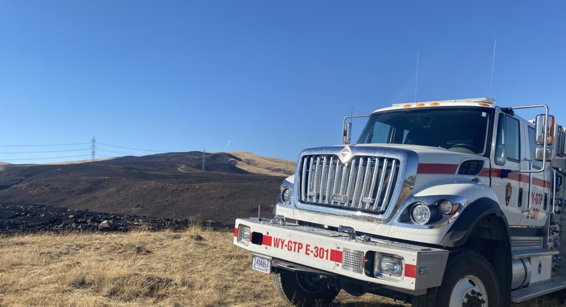 Fire crews tend the Trinity Fire just outside the Tri-Cities on August 14