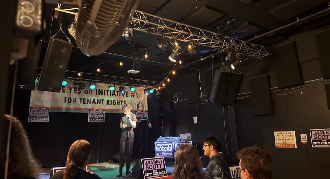 Zev Cook prepares to address the crowd of supporters gathered at Real Art Tacoma on election night. (Credit: Lauren Gallup / NWPB)