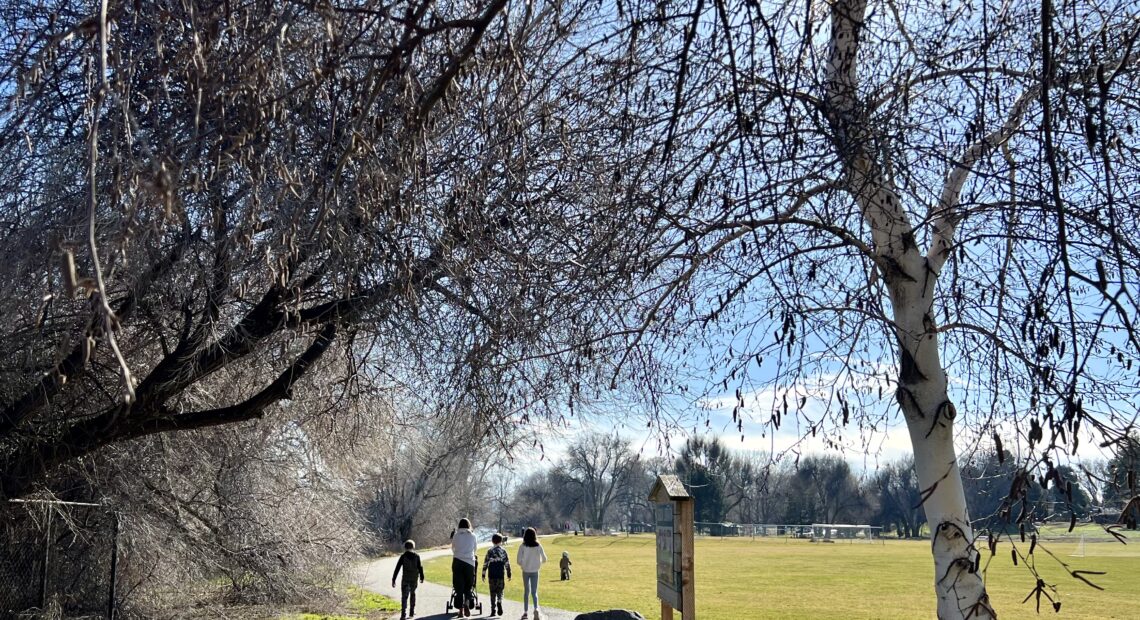 People walk along a trail at Leslie Groves Park in Richland, Wash. (Credit: Courtney Flatt / Northwest News Network)