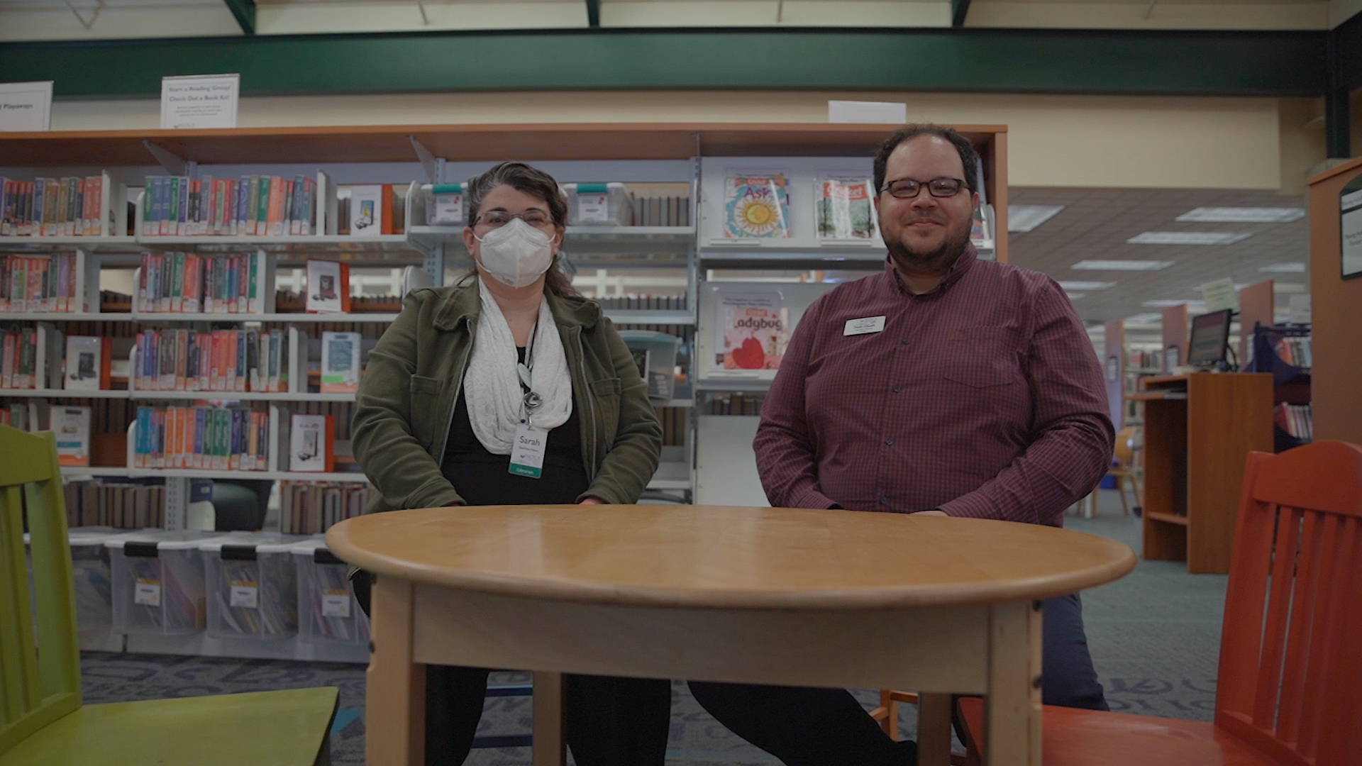 Sarah Morrison, left, and Noah Glaude, work together for the North Olympic Library System. Glaude wonders if changing demographics in the county could impact its bellwether status. (Credit: Tela Moss / NWPB)