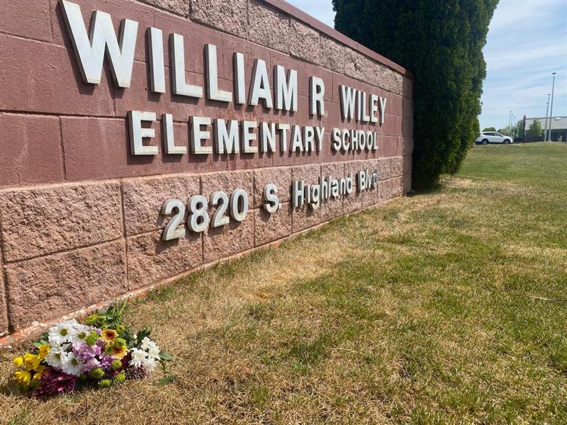 A bunch of flowers Tuesday afternoon lay near the sign for William Wiley Elementary School in West Richland. Students returned to class on Wednesday morning with therapy dogs and counselors.