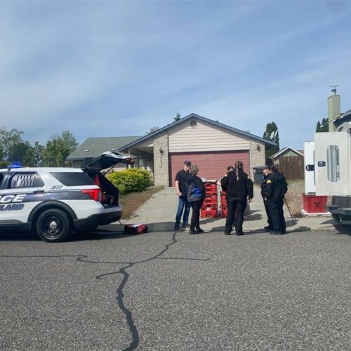 FBI, county and police officials wait for the all-clear to collect evidence at the home of Elias Huizar, 39, where his 17-year-old girlfriend, Angelica Santos, was found dead.