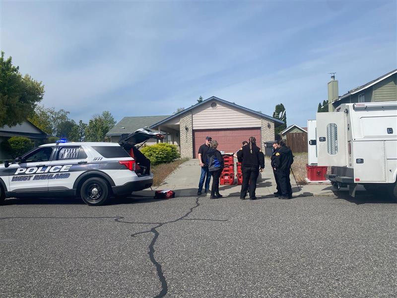 FBI, county and police officials wait for the all-clear to collect evidence at the home of Elias Huizar, 39, where his 17-year-old girlfriend, Angelica Santos, was found dead.