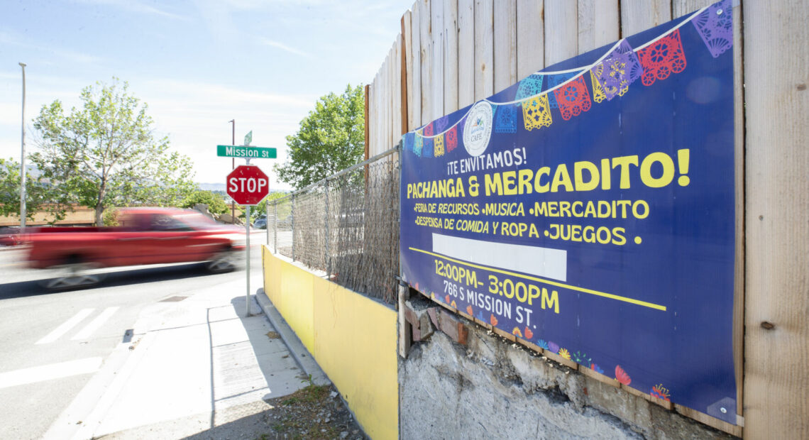 A banner for Community for the Advancement of Family Education's, known as CAFÉ, cultural event centered around sharing health care resources hangs on a fence near the intersection of Mission Street and Lewis Street Tuesday, May 14, 2024, in Wenatchee. The event will be on Saturday from 12 p.m. to 3 p.m. at 766 South Mission Street. (Wenatchee World/Jacob Ford)