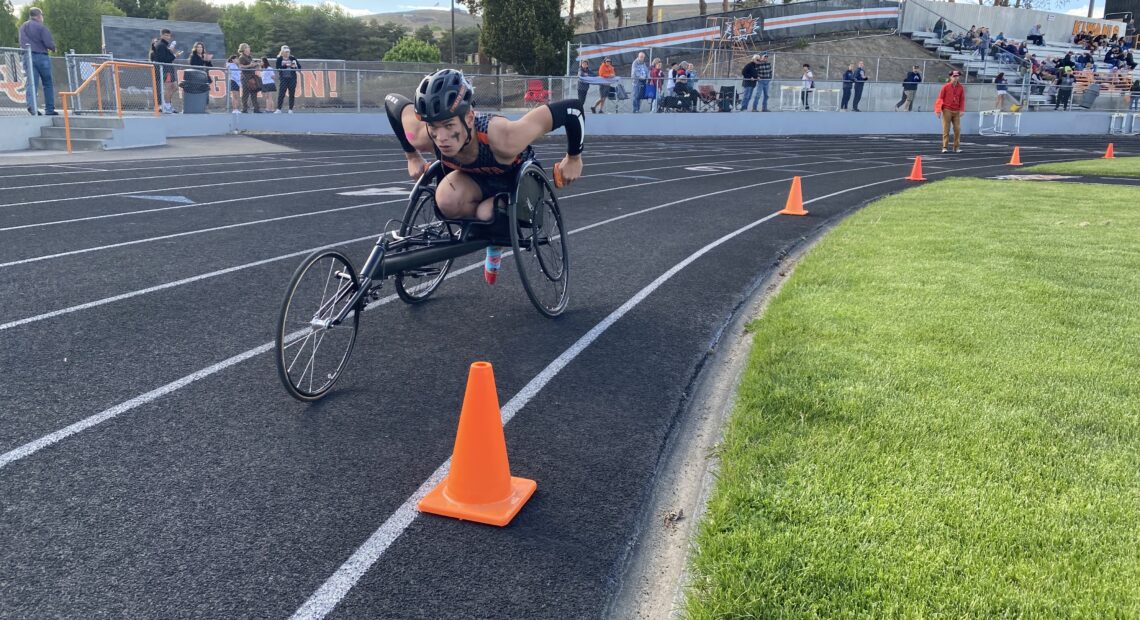 Ben Belino races the mile May 2 at Ephrata High School. The graduate had his left leg amputated after a bad car crash. The student plans to play wheelchair basketball for Eastern Washington University.