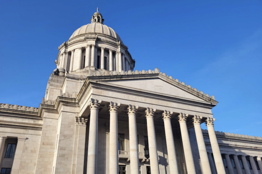 The Washington State Capitol building against a deep blue sky.