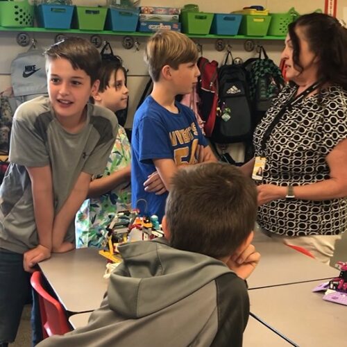 Teacher Bethany Olson at Livingston Elementary in Pasco, WA, with her students. (Credit: Johanna Bejarano / NWPB.)