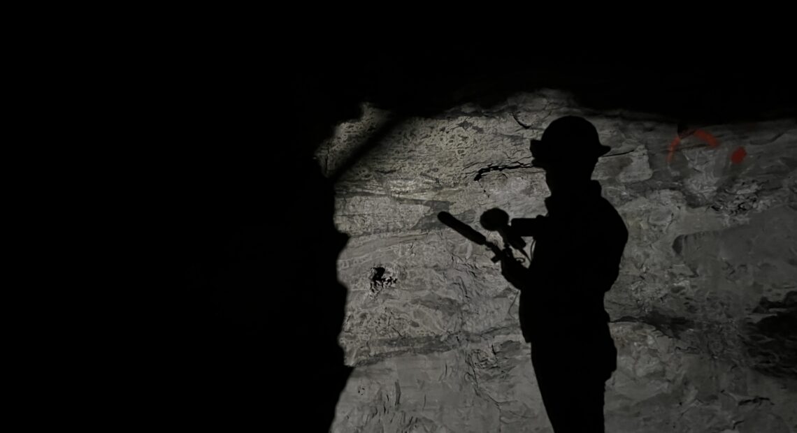 Creator and host Alec Cowan’s shadow during a tour of the Sunday Mine Complex, a complex of five uranium mines in the Big Gypsum Valley near Paradox, Colorado, on Feb. 19, 2024.