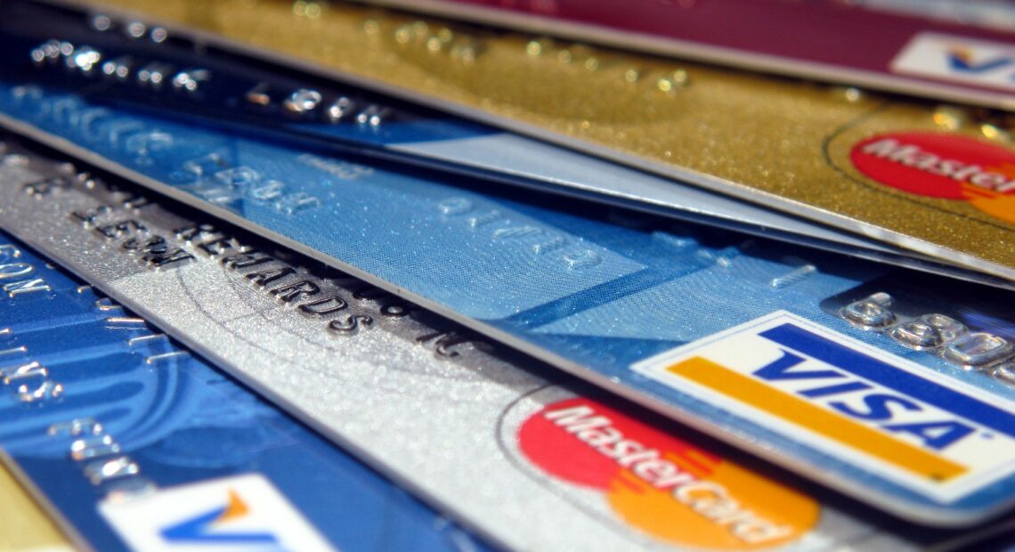 An assortment of credit cards is displayed.