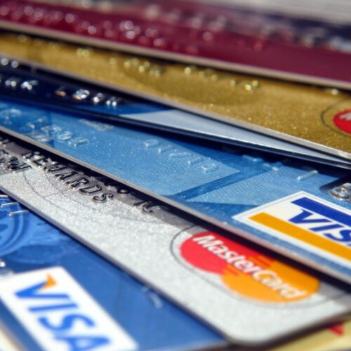 An assortment of credit cards is displayed.