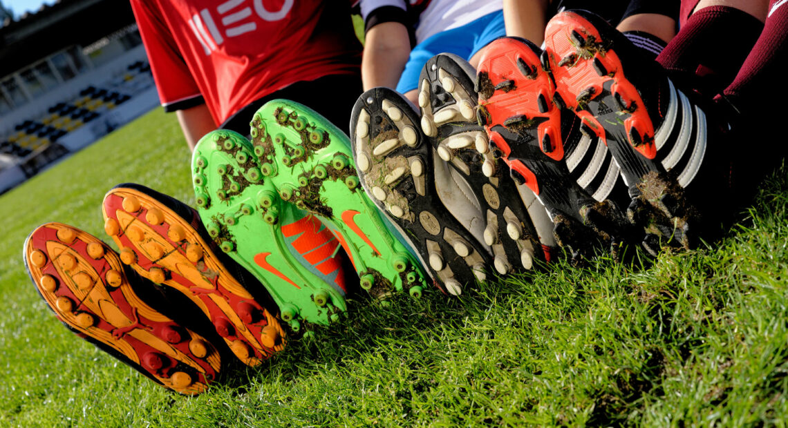 Closed-up-with-children-wearing-Football-or-Soccer-boots_Credit_Adfoto_stock.adobe