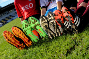 Closed-up-with-children-wearing-Football-or-Soccer-boots_Credit_Adfoto_stock.adobe