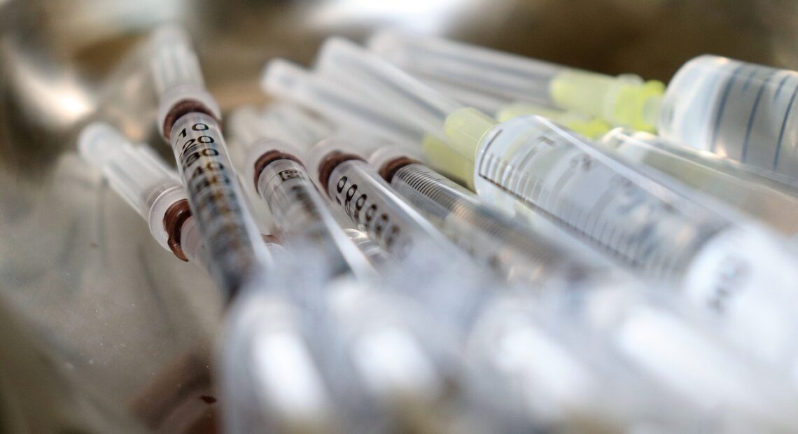 A close-up of vaccination syringes.